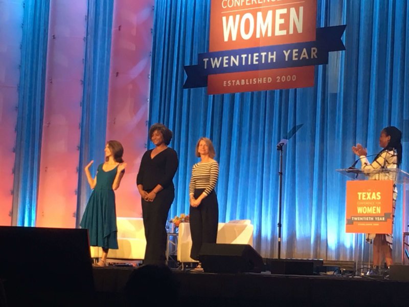 Megan Headley, on stage at the 2019 Texas Women's Conference accepting her "Power of Us" Contest award