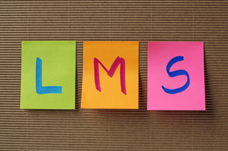 LMS acronym on colorful sticky notes corporate lms vs academic lms concept